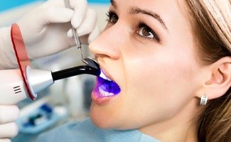 cosmetic dentist in Ocala giving a patient dental bonding