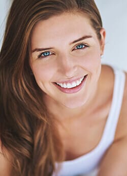 woman smiling in white fillers