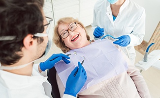 Dentist explaining how dental implants work in Ocala to patient