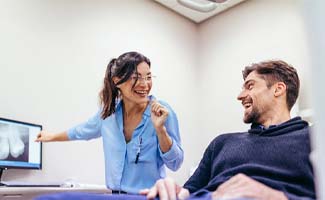 dentist talking to patient about dental bridges in Ocala