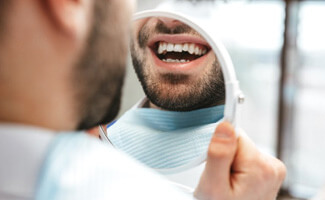 patient smiling after teeth whitening