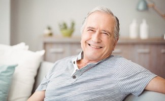 Senior woman sitting down and smiling