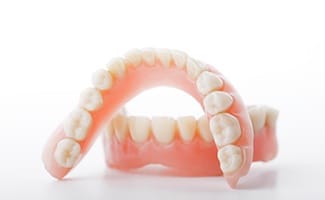 Complete upper and lower denture.
