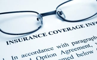 Insurance coverage information form with glasses
