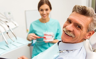 a patient receiving his dentures in Ocala