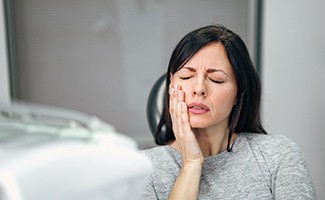 Woman with a dental emergency in Ocala