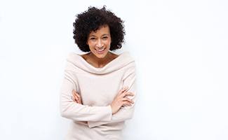 a patient smiling after understanding the cost of dental implants in Ocala