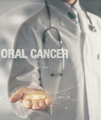 Doctor with hand out holding the words “oral cancer”