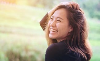 happy person walking in a field