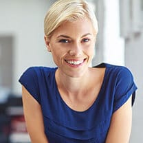woman in blue dress smiling