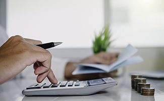 Man calculating cost of veneers in Ocala