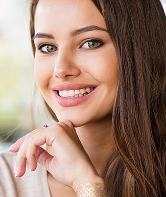 young woman smiling after getting teeth whitening in Ocala