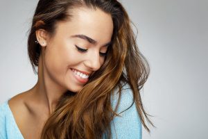 woman smiling, young woman, straight smile 