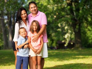 happy family posing outside