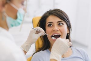 A woman having her dental exam.