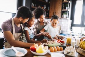 a family cooking a healthy meal during National Nutrition Month