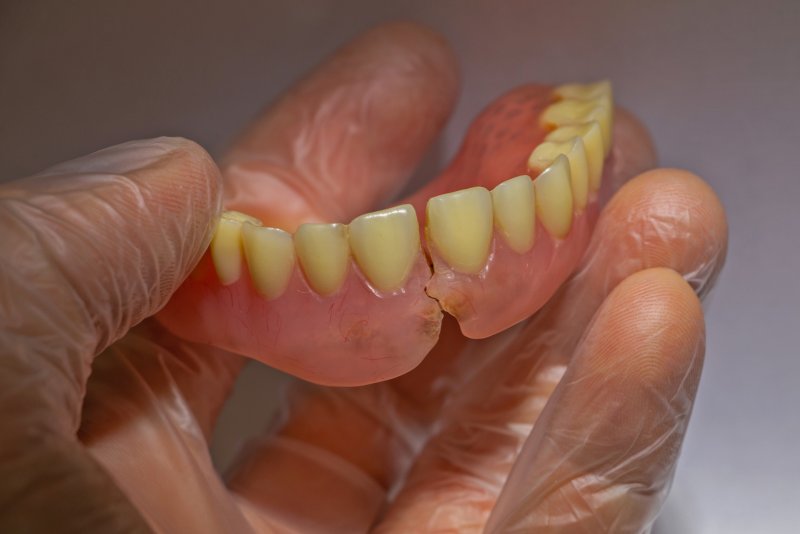 A close-up of a broken denture